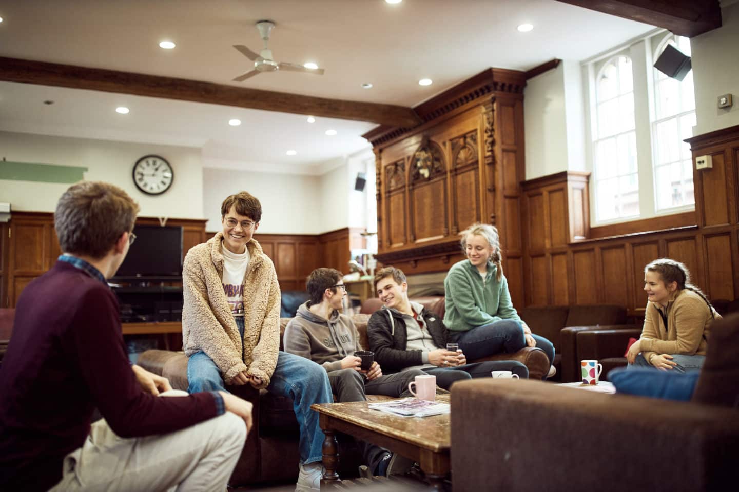 Students sitting around a table in the Lincoln College JCR